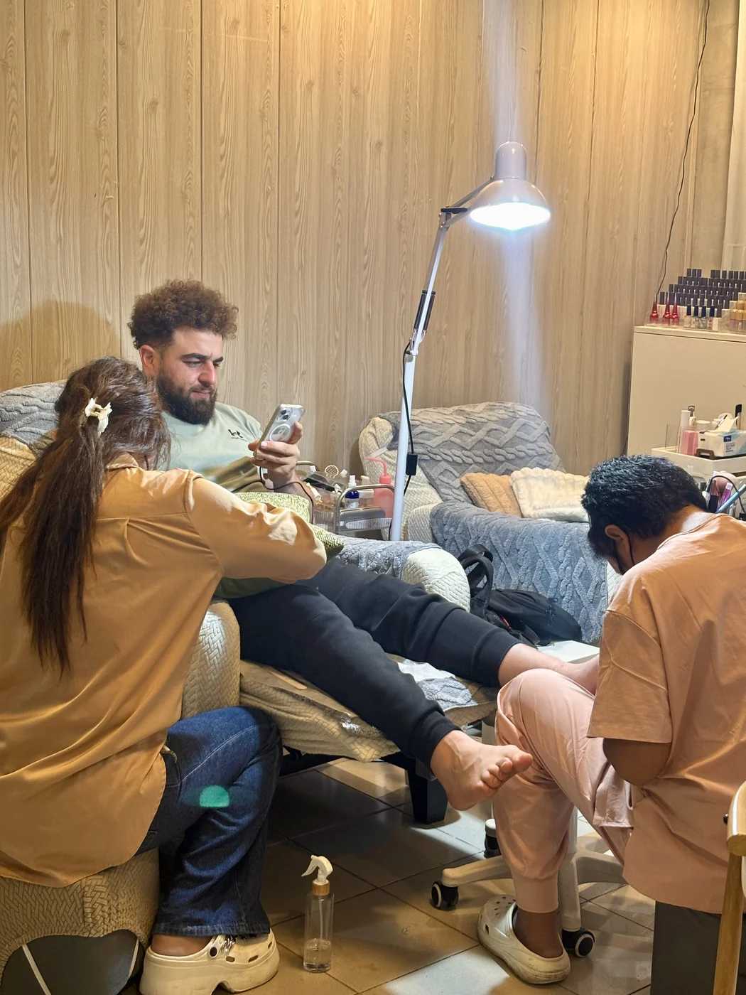 male client having a manicure and pedicure at the same time, AyuriNails Beauty Lounge Makati